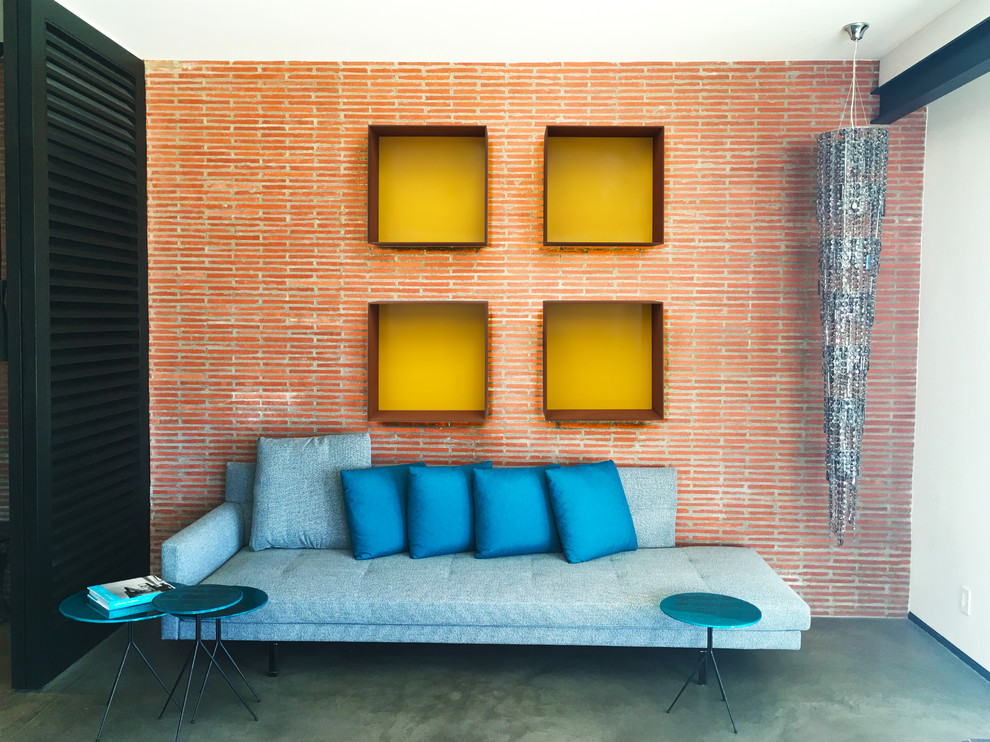 Example of a large urban loft-style concrete floor and gray floor family room design in Los Angeles with multicolored walls
