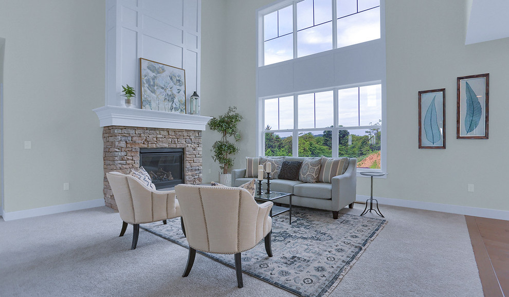 Ejemplo de sala de estar abierta tradicional extra grande con paredes grises, moqueta, todas las chimeneas, marco de chimenea de piedra y suelo beige