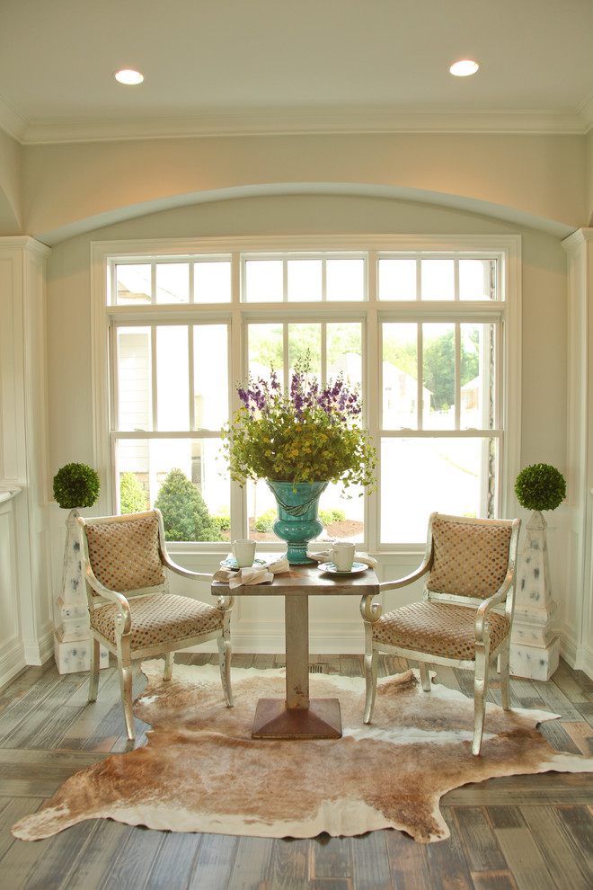 Inspiration for a french country medium tone wood floor family room remodel in Louisville with beige walls