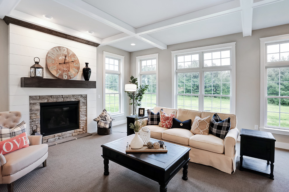 Large country enclosed carpeted and beige floor family room photo in Other with beige walls, a standard fireplace and a stone fireplace