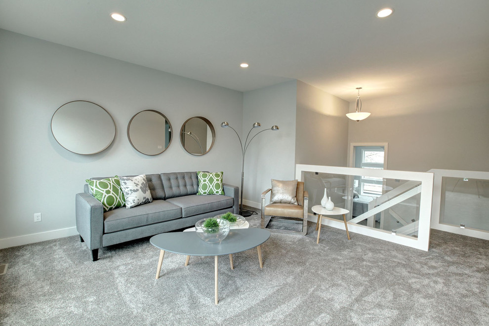 Foto di un grande soggiorno minimalista chiuso con pareti grigie, moquette, nessun camino e nessuna TV
