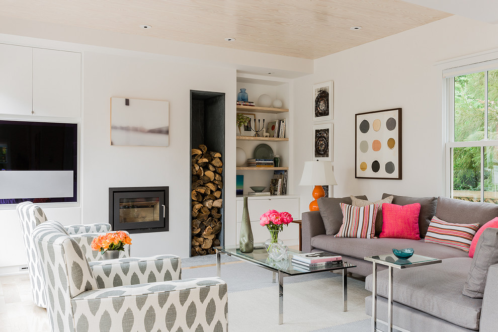 Family room - mid-sized scandinavian open concept family room idea in Boston with white walls, a wall-mounted tv, a plaster fireplace and a ribbon fireplace