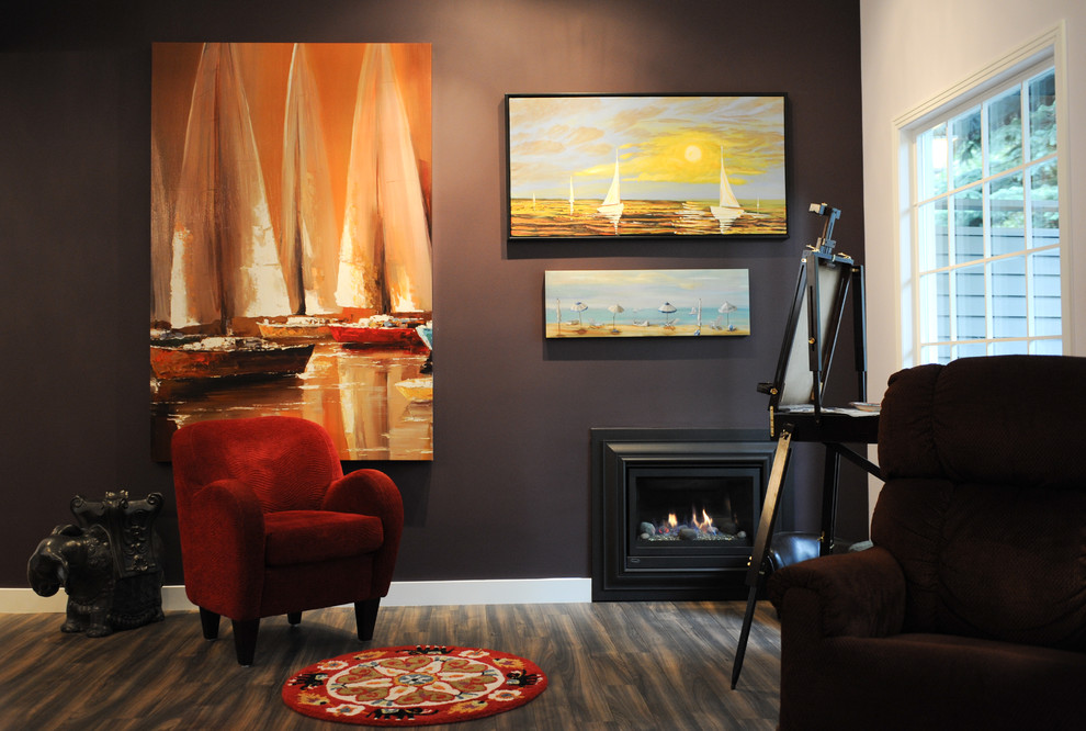 Medium sized traditional open plan games room in Calgary with purple walls, medium hardwood flooring, a standard fireplace, a metal fireplace surround and no tv.