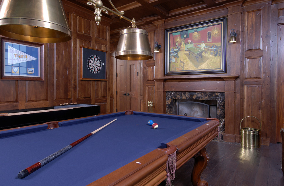 This is an example of a classic enclosed games room in Grand Rapids with brown walls, dark hardwood flooring, a standard fireplace and no tv.