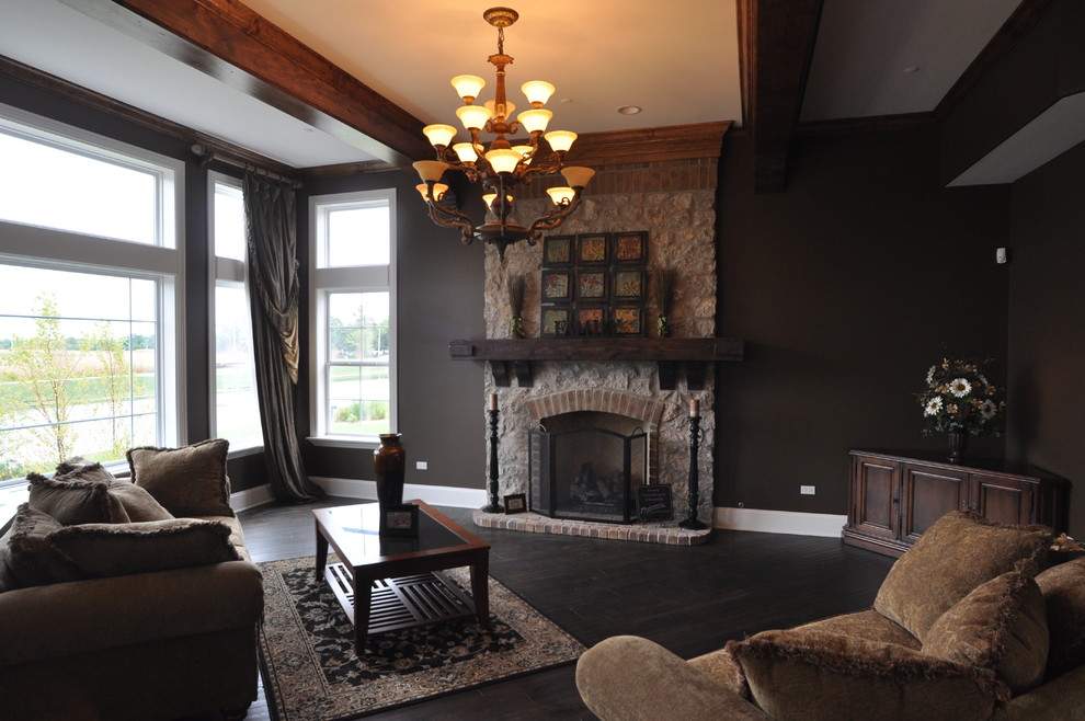 Inspiration for a large timeless open concept dark wood floor family room remodel in Chicago with a standard fireplace, a stone fireplace and black walls
