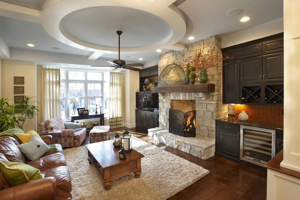 Example of a classic family room design in Chicago with a stone fireplace