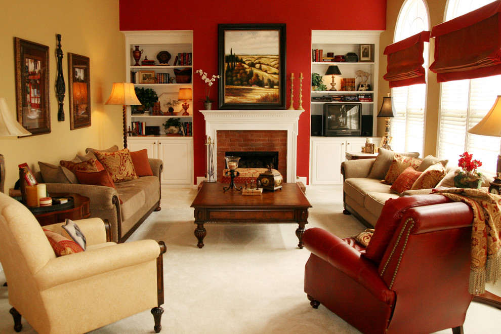 Family room - traditional carpeted and beige floor family room idea in Atlanta with red walls, a standard fireplace, a brick fireplace and a tv stand