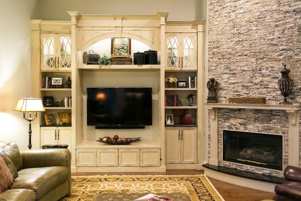 Medium sized traditional open plan games room in Orlando with beige walls, medium hardwood flooring, a corner fireplace and a built-in media unit.