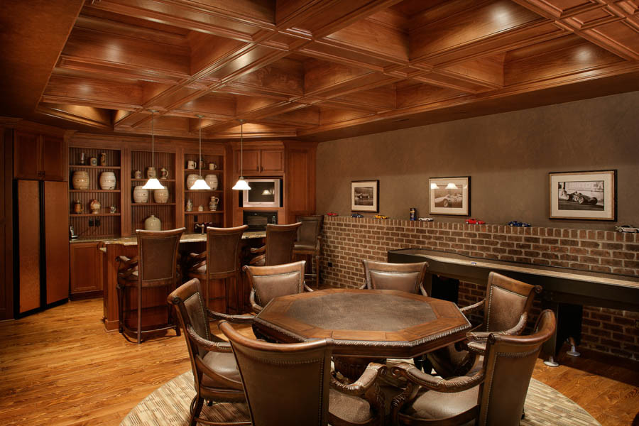 Inspiration for a large timeless enclosed medium tone wood floor game room remodel in Miami with brown walls, no fireplace and a wall-mounted tv