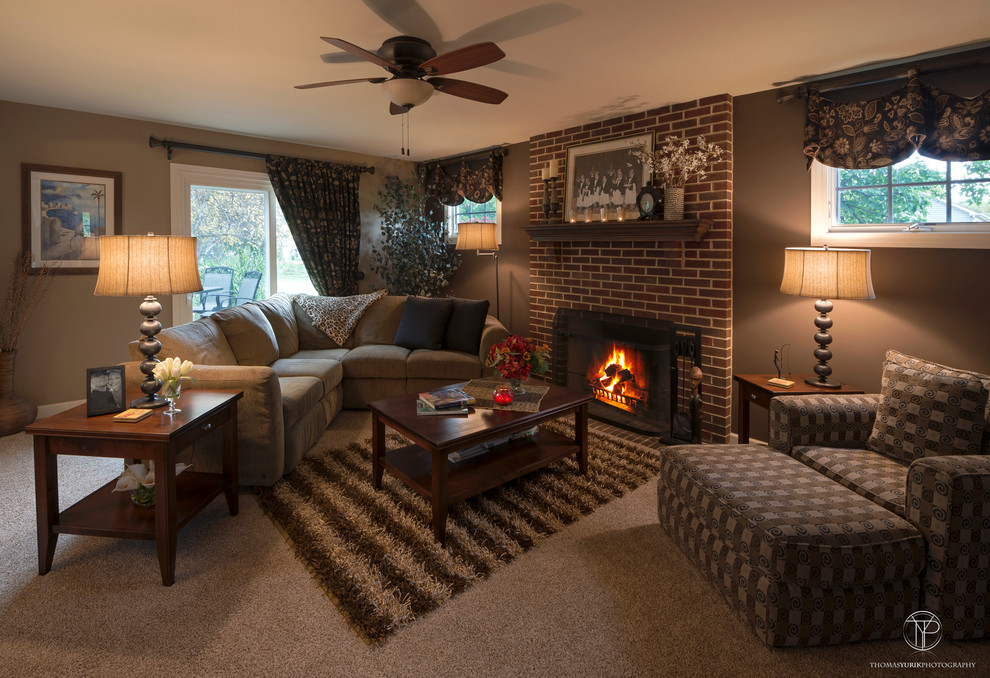 Medium sized classic open plan games room in Chicago with multi-coloured walls, carpet, a standard fireplace, a brick fireplace surround and a freestanding tv.