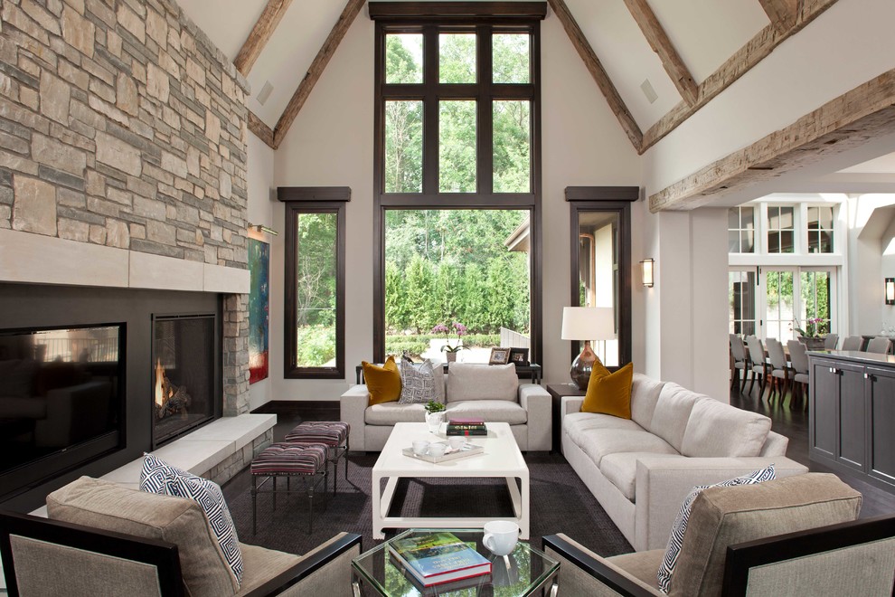 Large classic open plan games room in Minneapolis with white walls, a standard fireplace, a stone fireplace surround, carpet, grey floors and a built-in media unit.