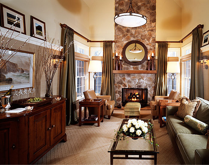 Mid-sized transitional enclosed carpeted and brown floor family room photo in New York with beige walls, a stone fireplace, a standard fireplace and no tv