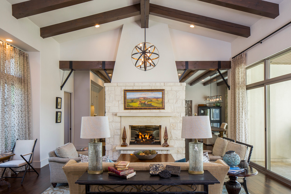 Large country open concept dark wood floor family room photo in Austin with white walls, a two-sided fireplace, a stone fireplace and no tv