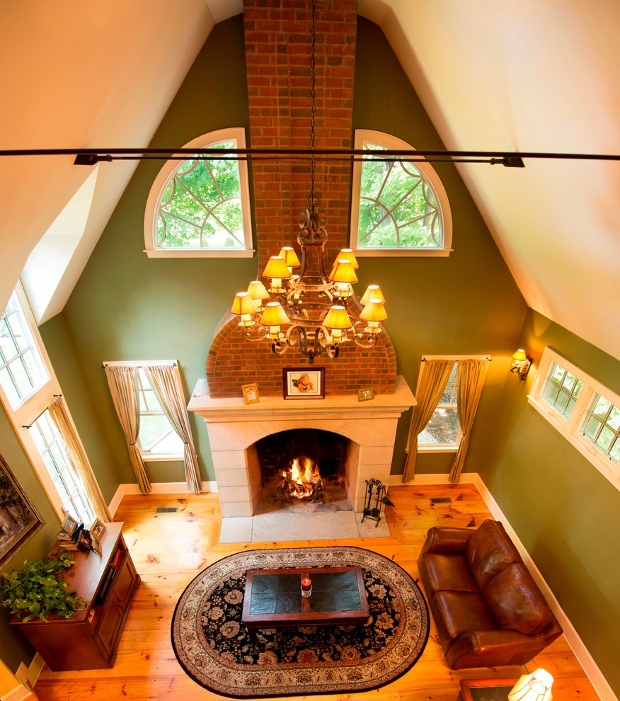 Inspiration for a mid-sized timeless open concept light wood floor family room remodel in Boston with green walls, a two-sided fireplace, a stone fireplace and no tv