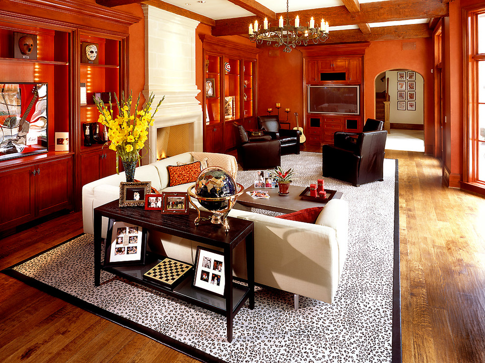Ispirazione per un soggiorno tradizionale con pareti arancioni