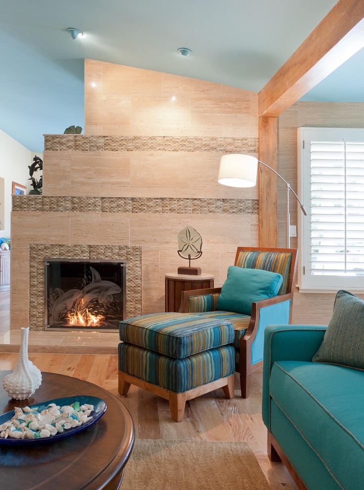 Design ideas for a world-inspired games room in Los Angeles with a tiled fireplace surround.