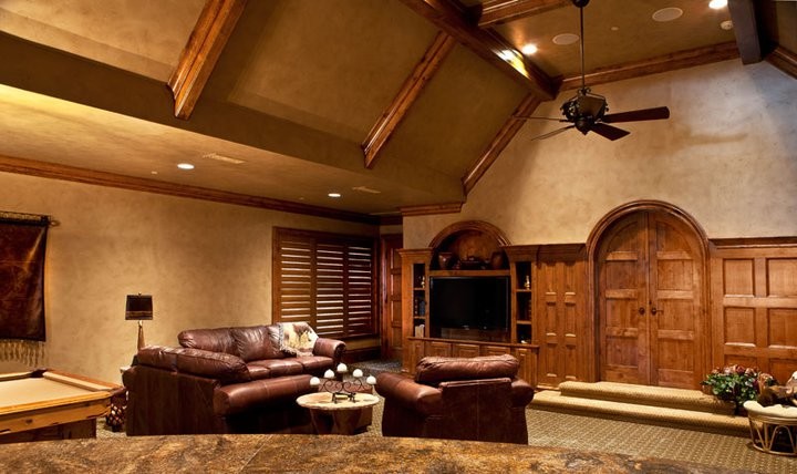 Large elegant enclosed carpeted and beige floor family room photo in Dallas with a bar, a media wall, beige walls and no fireplace