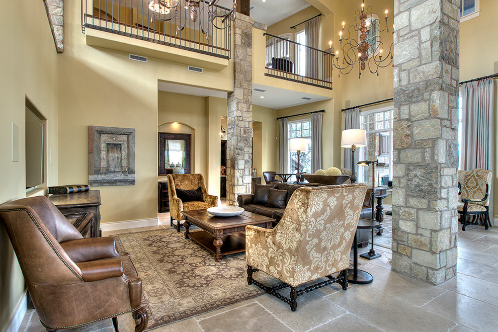 This is an example of a medium sized mediterranean open plan games room in Austin with limestone flooring.
