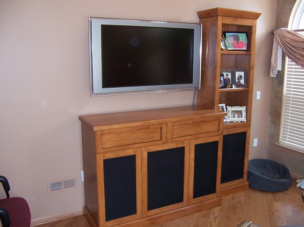 Mid-sized elegant enclosed medium tone wood floor game room photo in Philadelphia with brown walls and a wall-mounted tv
