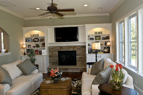 Living room with sage green walls and white trim