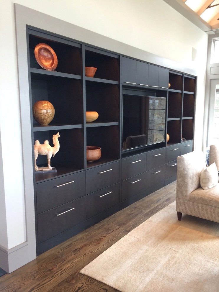 Expansive contemporary open plan games room in Boston with grey walls, dark hardwood flooring, a standard fireplace, a metal fireplace surround and a built-in media unit.