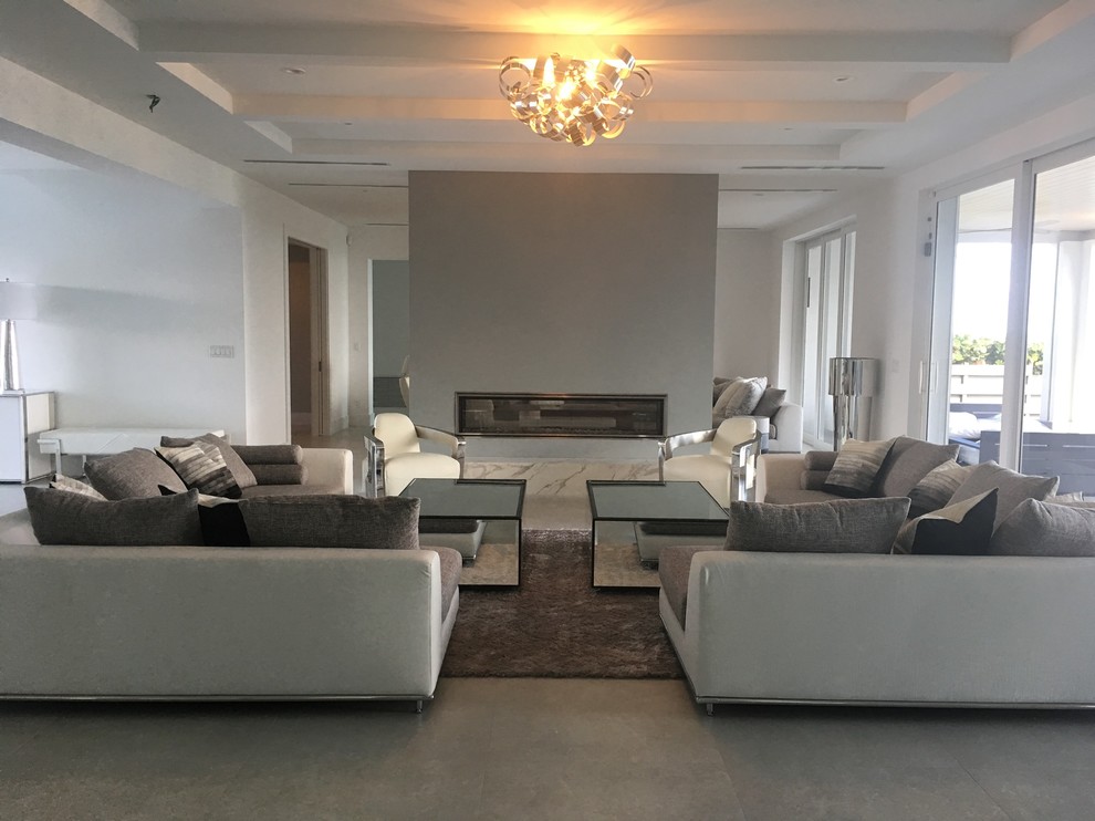 Large trendy open concept concrete floor family room photo in Miami with white walls, a ribbon fireplace and no tv