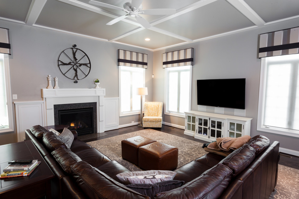 Inspiration for a medium sized traditional enclosed games room in DC Metro with grey walls, dark hardwood flooring, a standard fireplace, a wooden fireplace surround and a wall mounted tv.