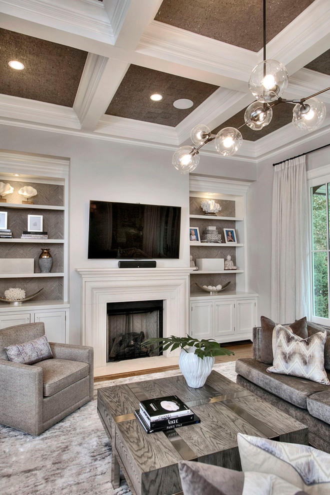 Example of a large transitional open concept dark wood floor and brown floor family room design in New York with gray walls, a standard fireplace and a plaster fireplace