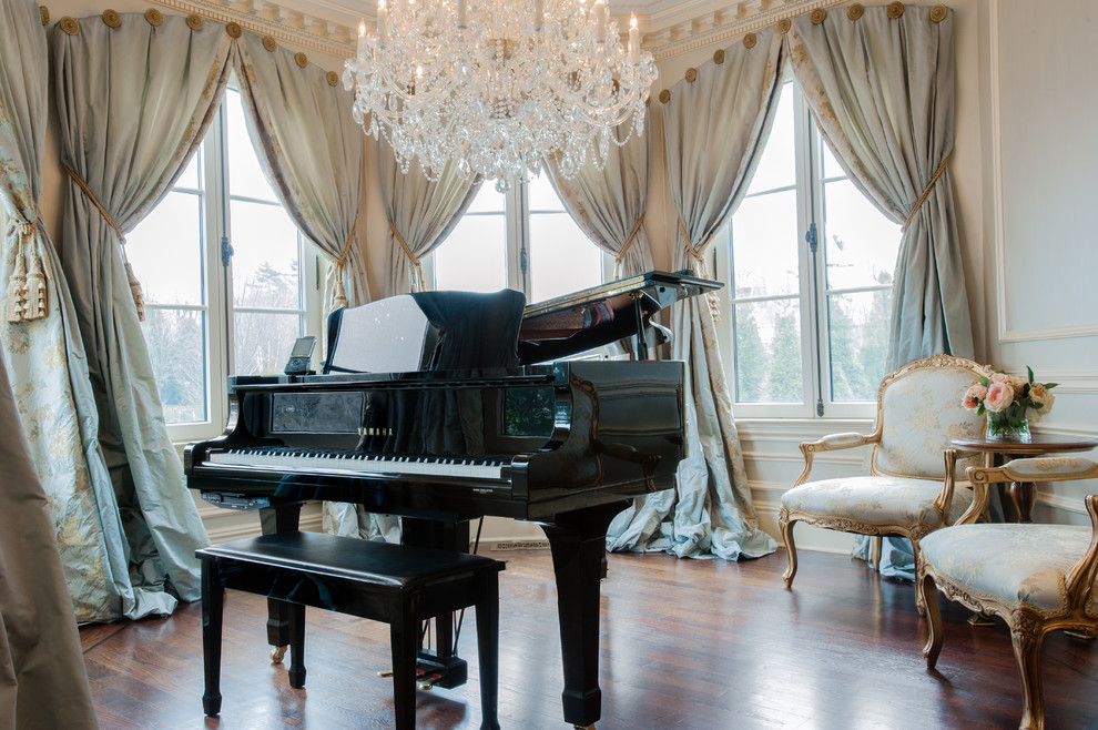 This is an example of a large victorian enclosed games room in New York with a music area, dark hardwood flooring, no tv and white walls.