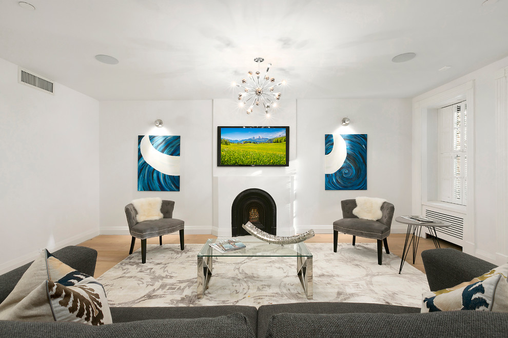 Mid-sized transitional enclosed light wood floor and brown floor living room photo in New York with white walls, a standard fireplace, a metal fireplace and a wall-mounted tv