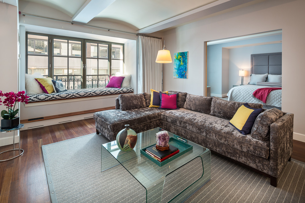 Immagine di un soggiorno contemporaneo di medie dimensioni e aperto con pavimento in legno massello medio e tappeto
