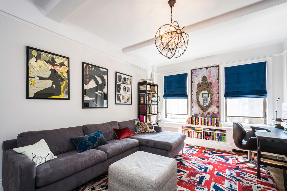 Eclectic medium tone wood floor family room library photo in New York with no fireplace and no tv