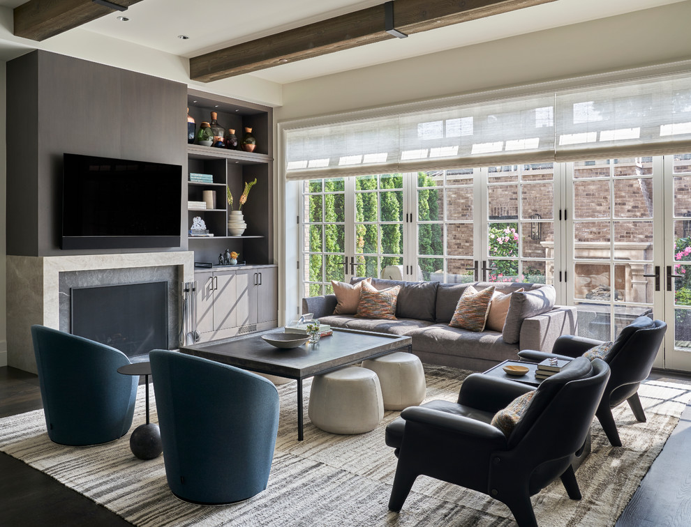 Inspiration for a classic games room in Chicago with dark hardwood flooring, a standard fireplace, a stone fireplace surround and a wall mounted tv.