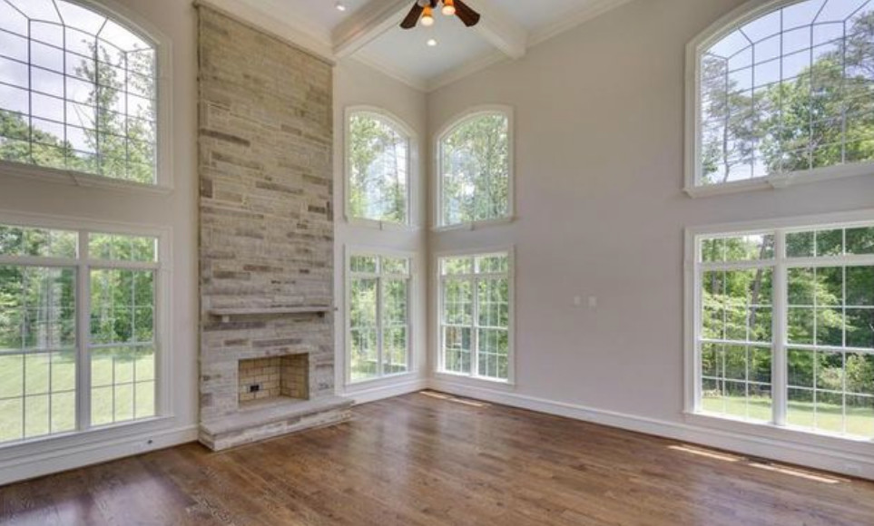 Inspiration for a huge timeless open concept dark wood floor family room remodel in DC Metro with a standard fireplace, a stone fireplace and no tv