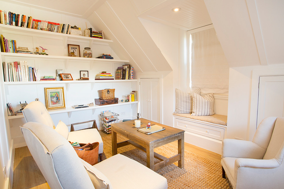 Family room library - eclectic light wood floor family room library idea in Los Angeles with white walls