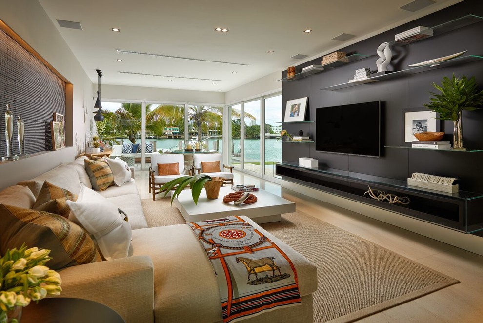 This is an example of a large contemporary open plan games room in Miami with grey walls, no fireplace and a built-in media unit.