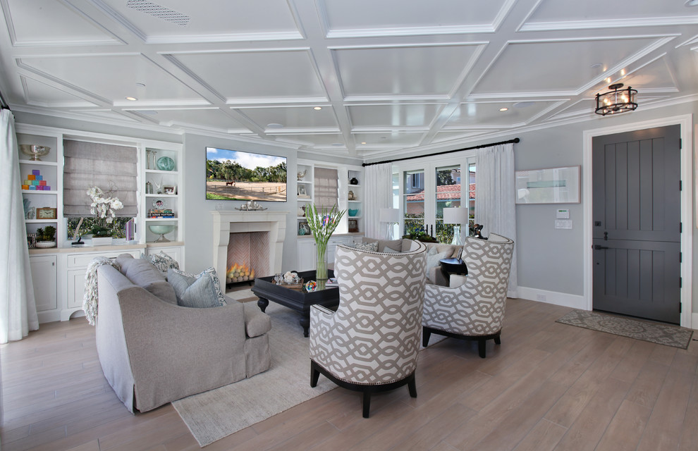 Example of a light wood floor family room design in Orange County