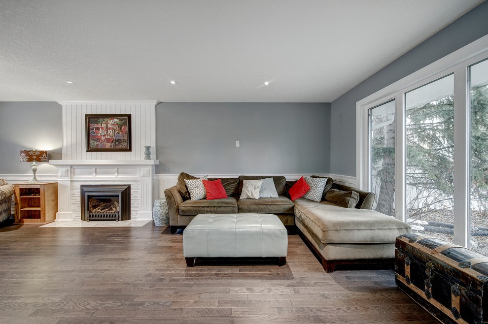 Mid-sized arts and crafts open concept medium tone wood floor and brown floor family room photo in Calgary with a music area, gray walls, a standard fireplace, a tile fireplace and no tv
