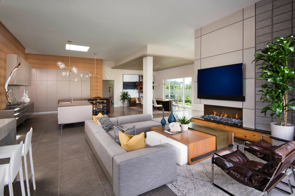 Family room - contemporary open concept family room idea in Phoenix with a ribbon fireplace and a wall-mounted tv