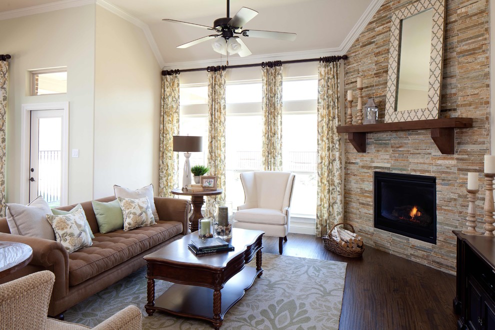 Family room - traditional dark wood floor family room idea in Dallas with beige walls, a corner fireplace and a stone fireplace