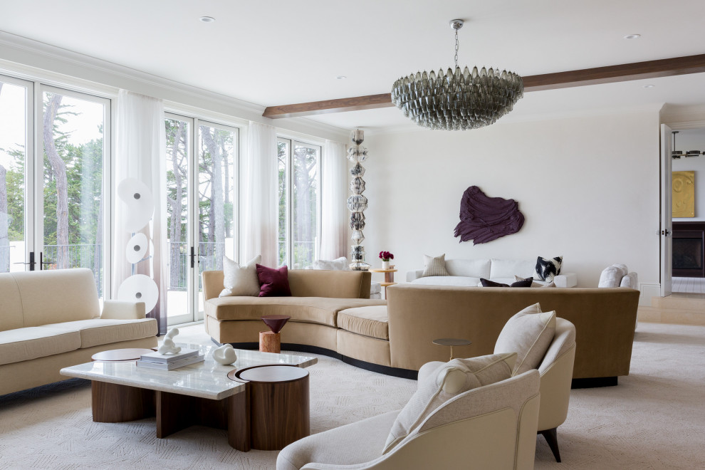 Immagine di un ampio soggiorno design aperto con pareti bianche e camino classico