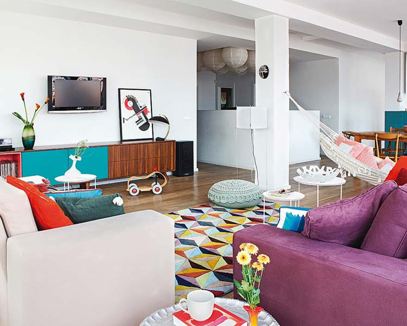 Example of a large eclectic open concept dark wood floor family room design in Madrid with white walls, no fireplace and a wall-mounted tv