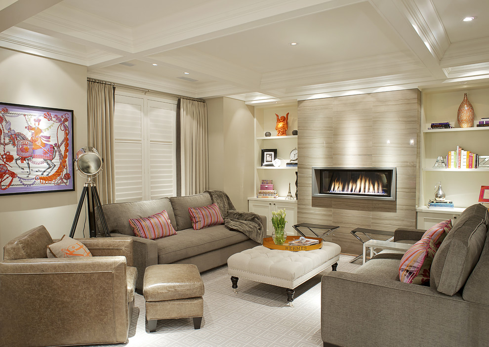 Example of a transitional carpeted family room design in Toronto with beige walls, a ribbon fireplace and no tv