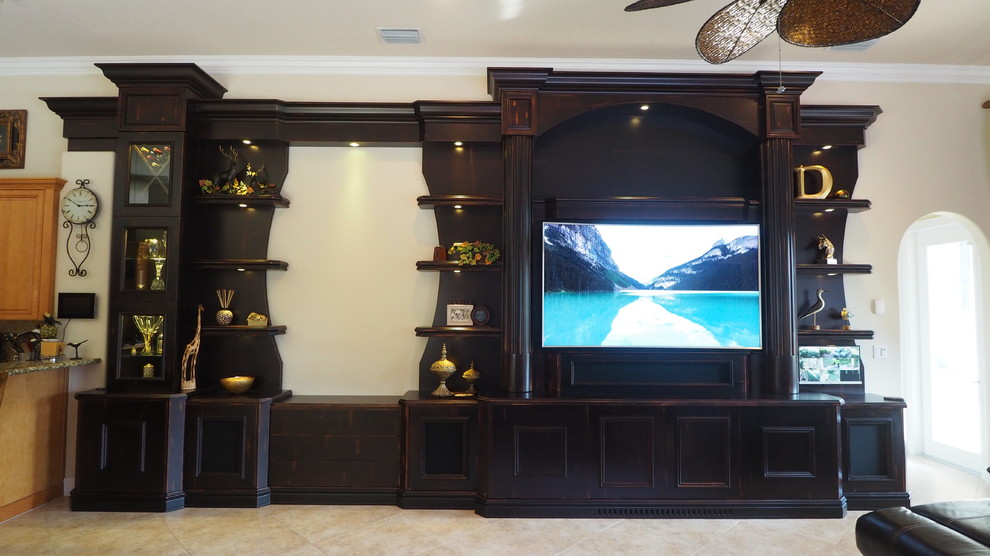 This is an example of a medium sized contemporary open plan games room in Miami with beige walls, no fireplace and a built-in media unit.