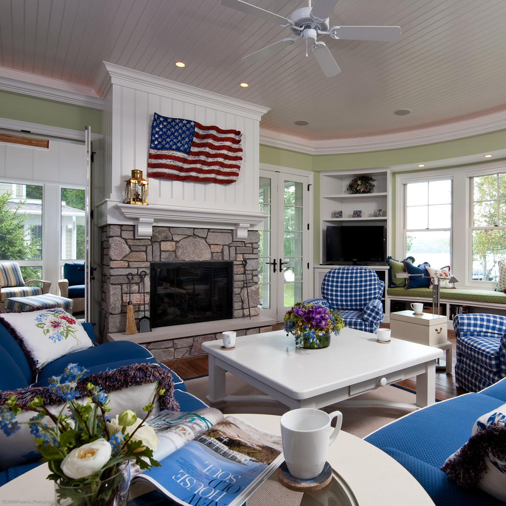 Family room - coastal family room idea in Other with green walls, a standard fireplace and a stone fireplace
