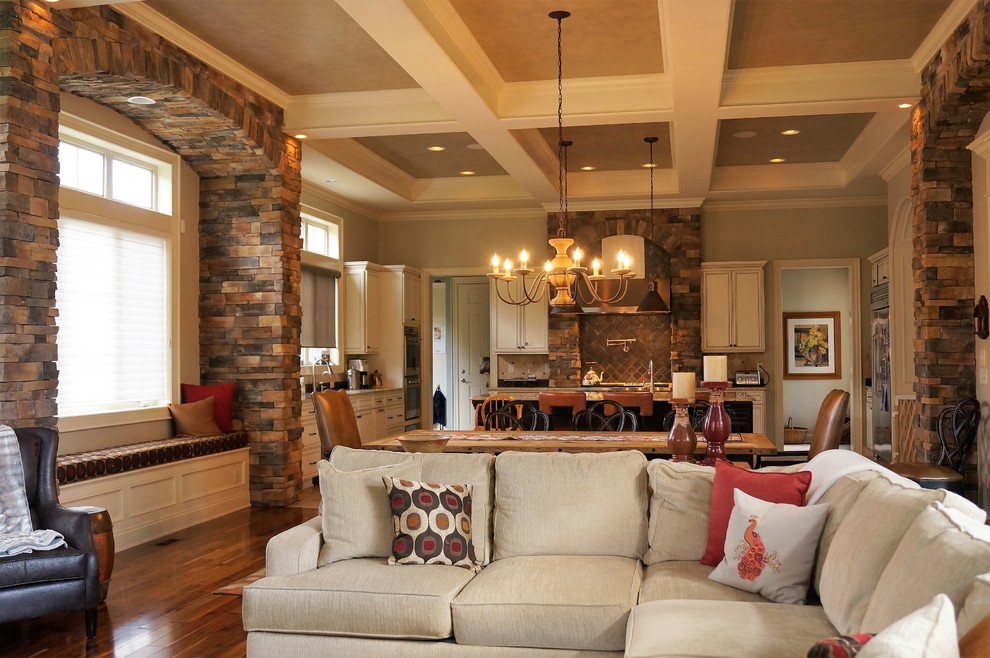 Inspiration for a large transitional open concept medium tone wood floor family room remodel in Columbus with a standard fireplace and a stone fireplace