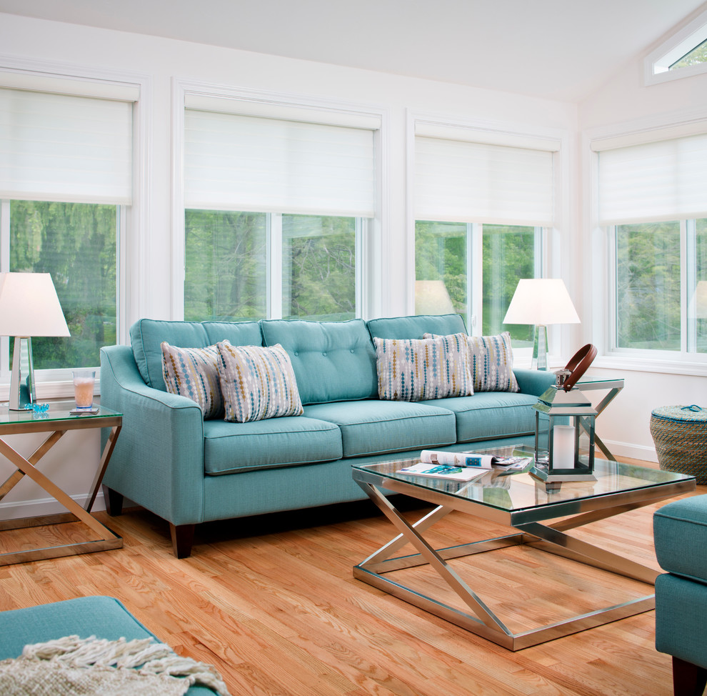 Inspiration for a contemporary medium tone wood floor family room remodel in Boston with white walls