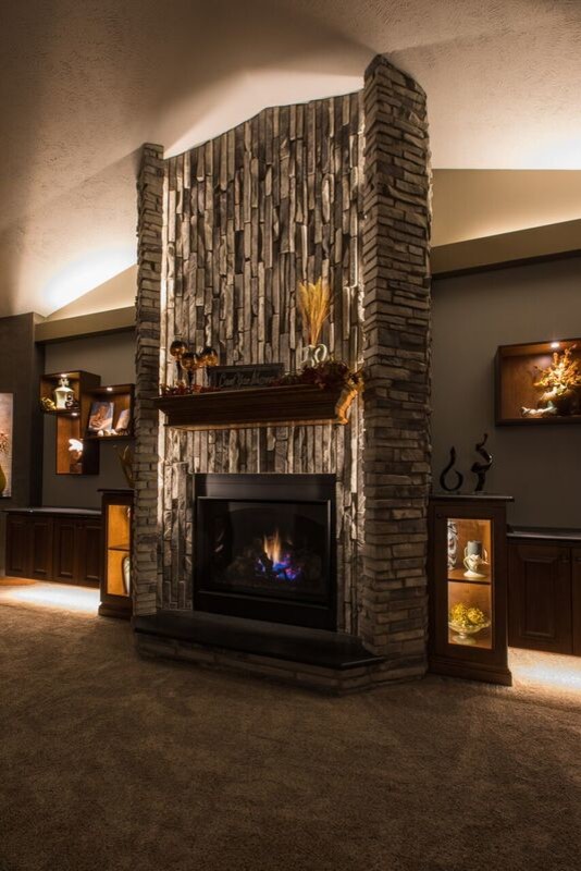 Inspiration for a large classic enclosed games room in Other with carpet, a standard fireplace, a stone fireplace surround and a wall mounted tv.