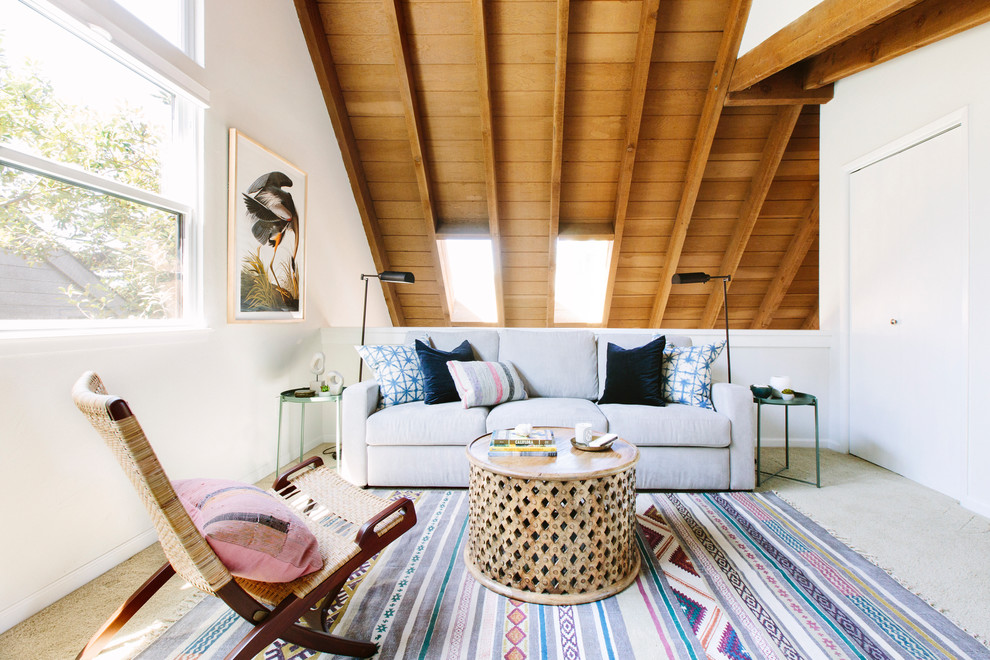 Example of a beach style carpeted and beige floor family room design in San Francisco with white walls