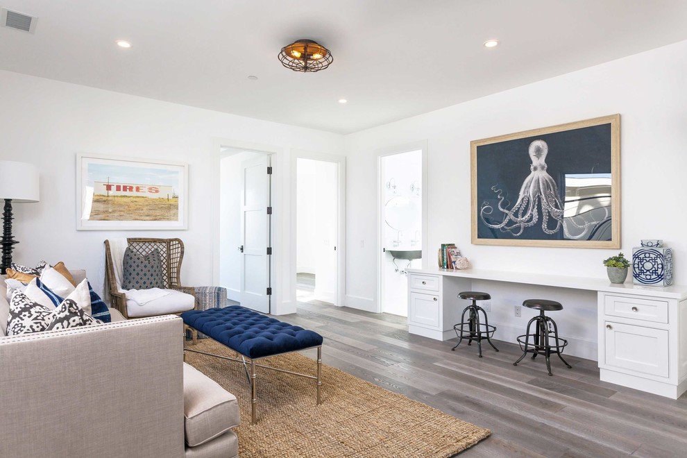 Inspiration for a large beach style enclosed games room in Orange County with white walls, dark hardwood flooring and grey floors.